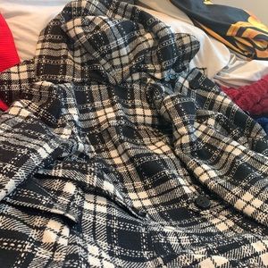 Black & white Pea coat , it’s a silky material inside , this is a medium ,